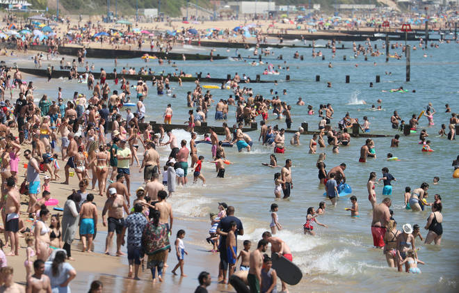 Crowds gather on the beach in Bournemouth