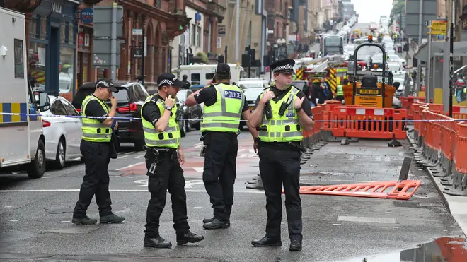 Police officers at the scene in West George Street, Glasgow