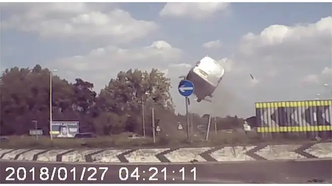The speeding van hits the roundabout and flies through the air