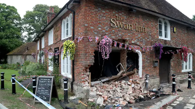 The crashed car left a gaping hole in the pub wall