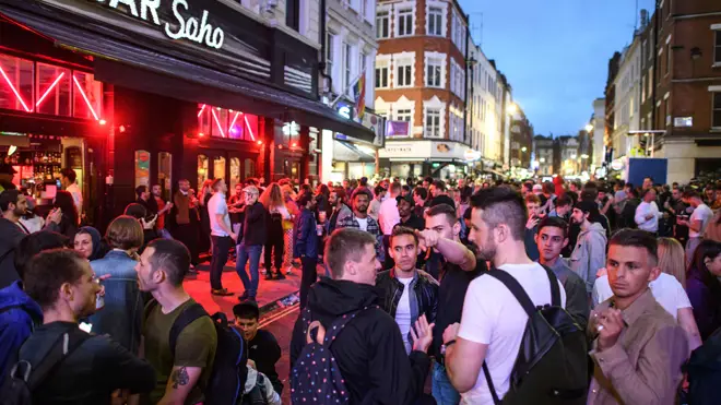 A large crowd in Soho in London last night