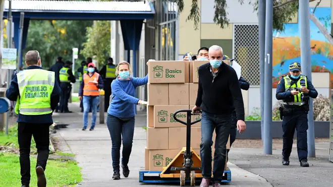 People distribute supplies in the lockdown in Melbourne