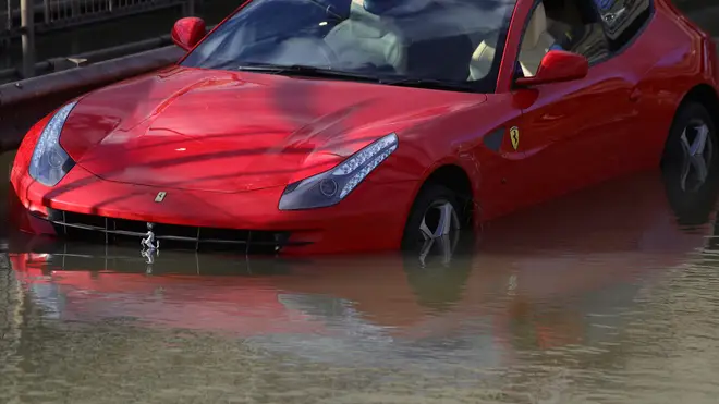 Cars remain abandoned on the A406 after the flooding