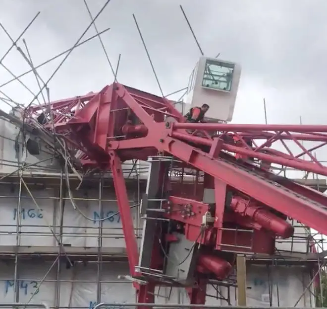 The crane crushed at least two houses as it collapsed