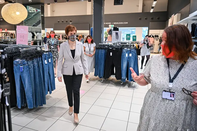 First Minister Nicola Sturgeon, wearing a Tartan face mask during a visit to New Look