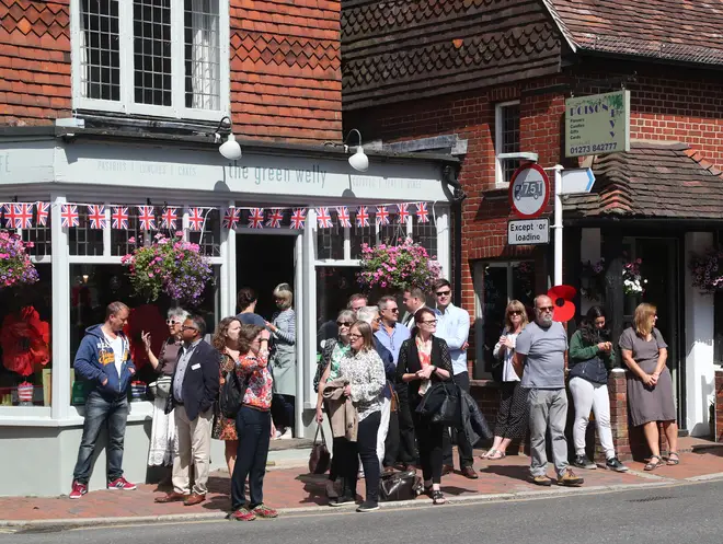 Local residents begin to gather in Ditchling, East Sussex, ahead of the funeral for Forces Sweetheart Dame Vera Lynn