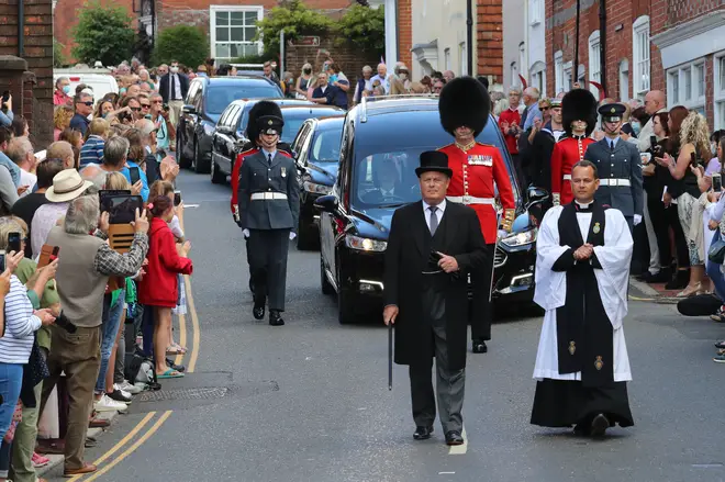 The funeral cortege of Forces Sweetheart Dame Vera Lynn is escorted through Ditchling