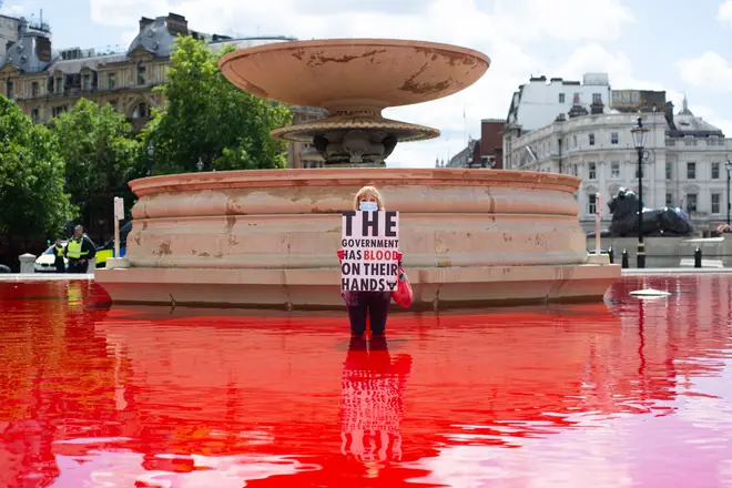 Activists dyed the Trafalgar Square fountains red on Saturday