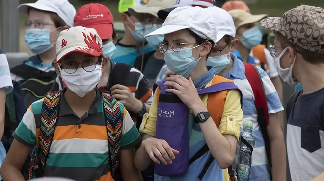 Children wear face masks to school in other countries following the coronavirus pandemic