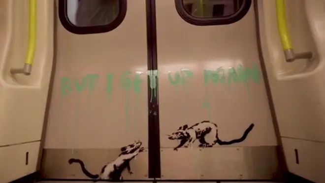 Banksy has been filmed spray painting the tube