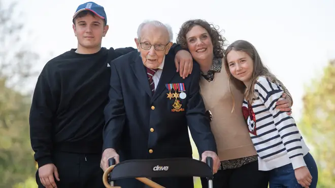 Captain Tom Moore, with (left to right) grandson Benji, daughter Hannah Ingram-Moore and granddaughter Georgia