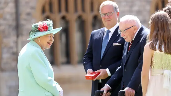 The Queen knighted Sir Tom in a unique open-air ceremony