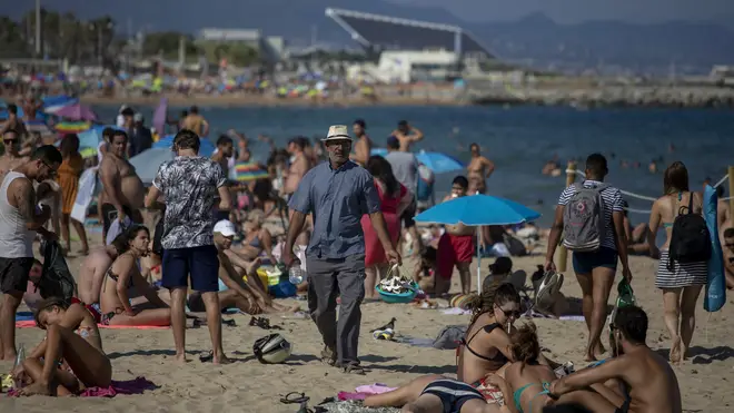 Spain has limited access to beaches in Barcelona after a surge of new infections
