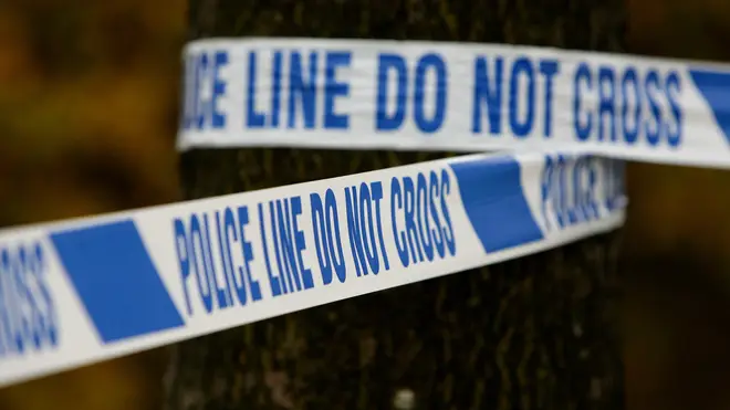 A pair are being hunted after a police officer was dragged 40ft by a police car