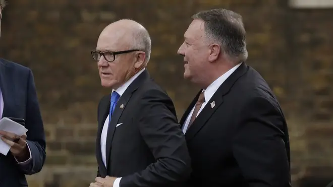 US Ambassador Woody Johnson (pictured with Secretary of State Mike Pompeo) has been accused of making racist and sexist comments