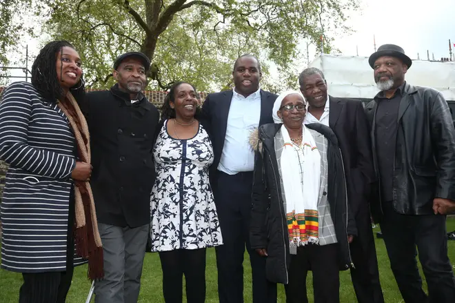 Labour MPs David Lammy (centre) and Dawn Butler (left) with members of the Windrush generation (left to right) Anthony Bryan, Sarah O'Connor, Paulette Wilson, Sylvester Marshall and  Elwaldo Romeo