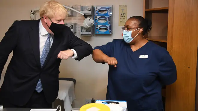 Boris Johnson meets staff at a GP in east London today