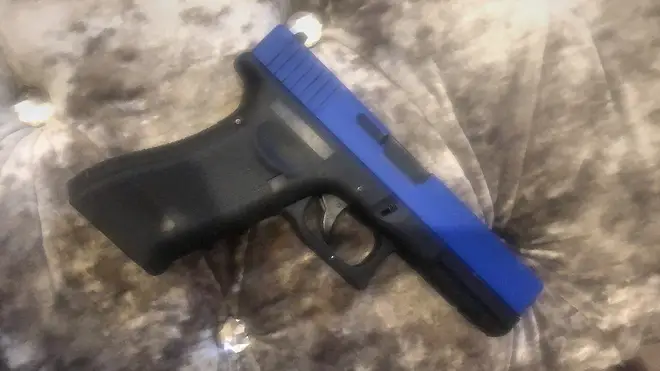 The gun was a BB pellet gun fitted with a blue slider to distinguish it from a real one