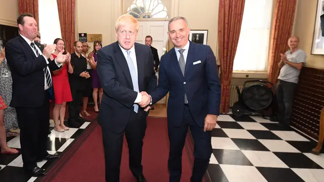 Prime Minister Boris Johnson shaking hands with Sir Mark Sedwill