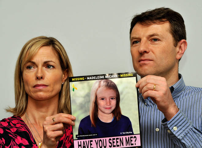 Gerry and Kate McCann whose daughter Madeleine disappeared from a holiday flat in Portugal in 2007 at a press conference in London where they hold an image of what Madeline might look like as an older girl
