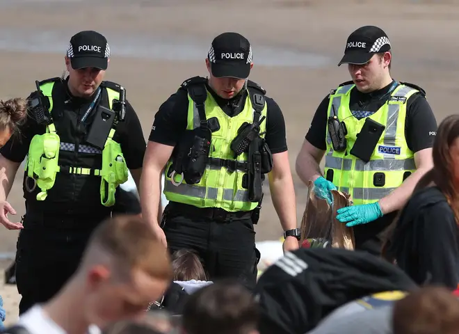 Police at Portobello Beach in Edinburgh confiscated alcohol from beachgoers and broke up large crowds