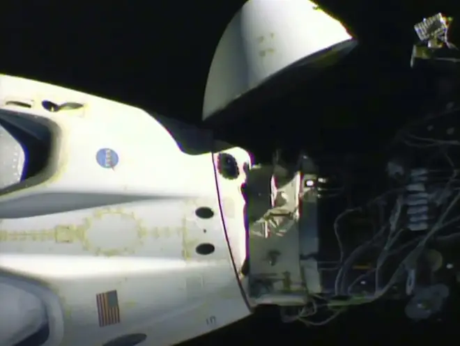 An image released by Nasa shows the Crew Dragon capsule detaching from the International Space Station