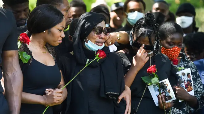 Khaji and Alex's mother Victoria mourn together at his funeral