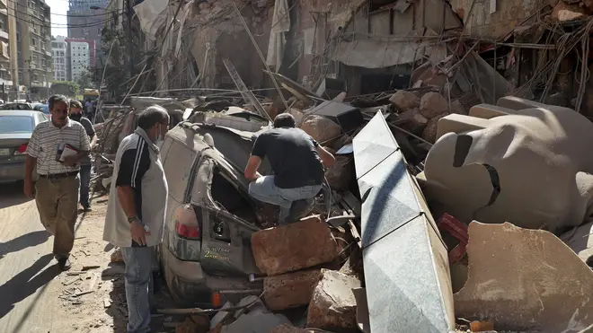 Locals comb through the wreckage to find survivors