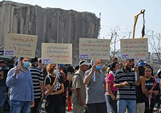 Lebanese protesters lift a gallows and placards berating politicians in Beirut
