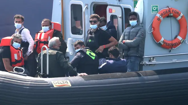 A group of people thought to be migrants are brought into Dover, Kent, by Border Force officers following a number of small boat incidents in the Channel on Wednesday