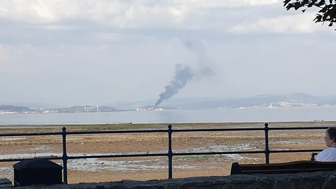 Smoke can be seen from across the city
