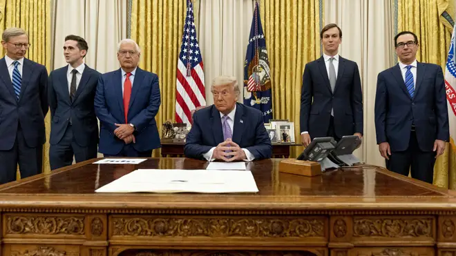 President Donald Trump in the Oval Office at the White House after the deal was announced