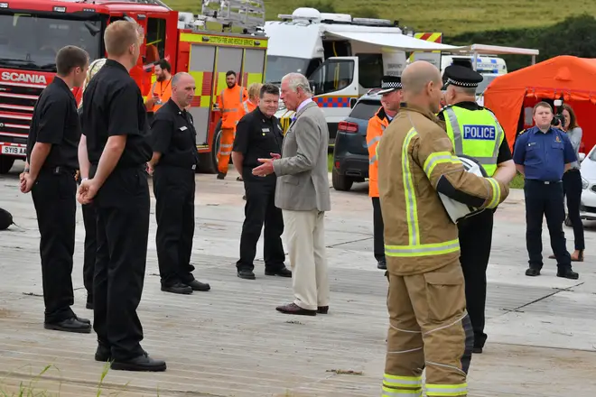 Prince Charles has met with emergency responders at the site of the fatal Stonehaven train crash which killed three people.