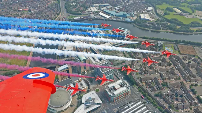 Ministry of Defence handout photo of The Red Arrows, carrying out a flypast over Belfast