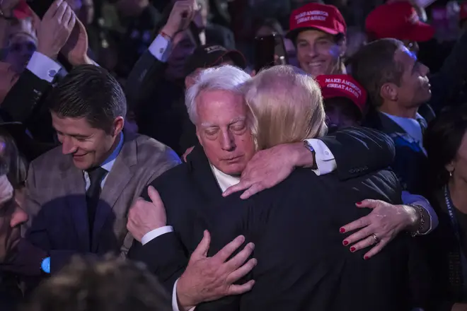 Robert Trump (L) hugging his older brother Donald