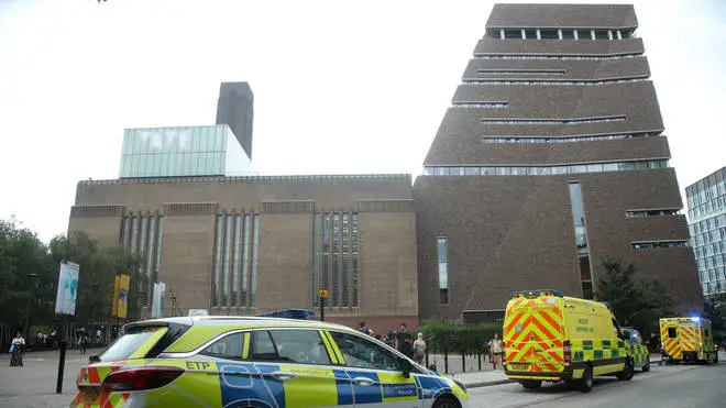 Police at the scene where the boy was thrown from the Tate Modern
