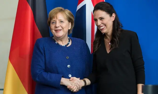 Angela Merkel (L) and Jacinda Ardern (R) have overseen lower Covid-19 death rates in Germany and New Zealand