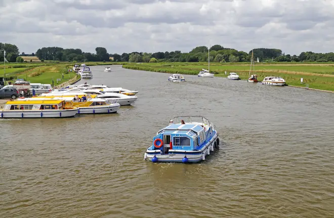 The woman became 'trapped under a boat' on the River Bure (file photo)