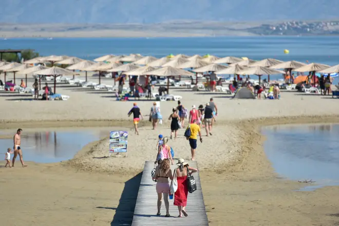 Tourists enjoy on a Queen's Beach in Nin, Croatia