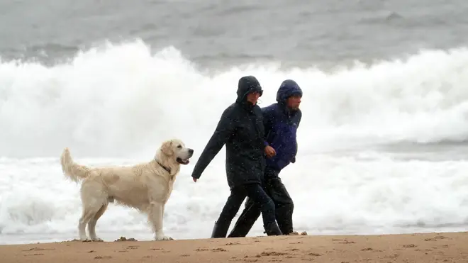 Walkers on a windy Tynemouth beach as Storm Francis has brought gusts of more than 50mph overnight ahead of the wet and windy weather impacting vast swathes of the UK and Ireland.