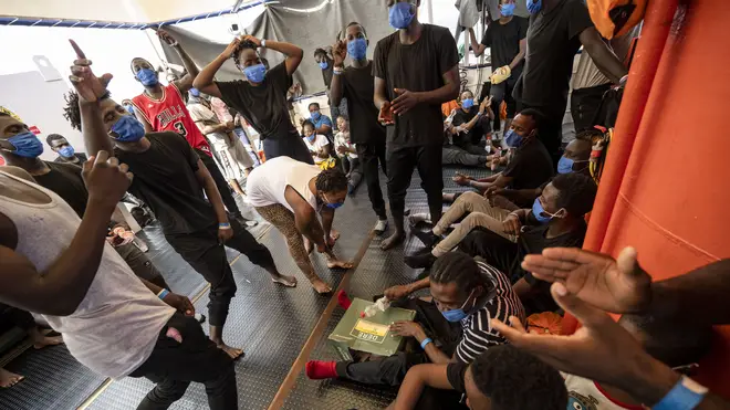 Migrants from eastern Africa dance onboard the Sea-Watch 4 civil sea rescue ship