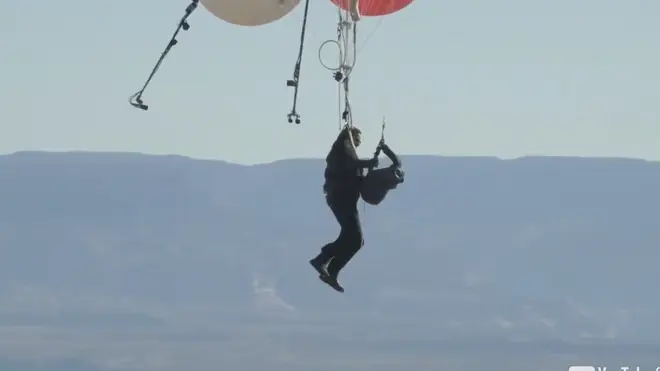 David Blaine attaching himself to his parachute mid-flight