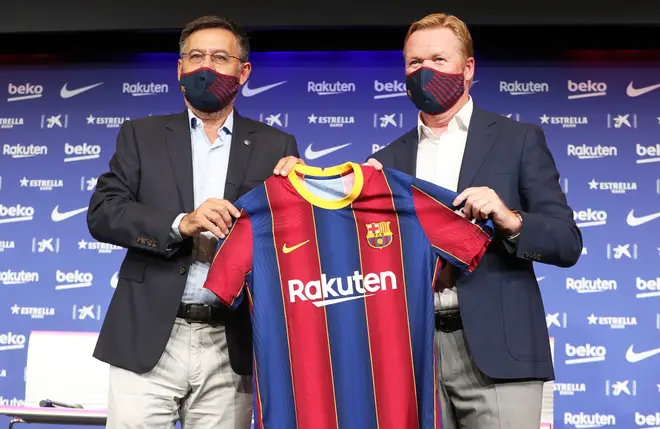 New manager Koeman (R) poses with president Bartomeu (L) whose running of the club Messi is unhappy with