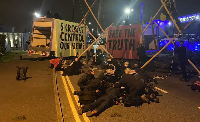 Extinction Rebellion protesters have blockaded a printworks in Liverpool