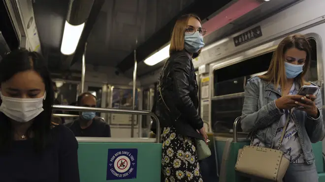 Women wear masks on the Paris metro