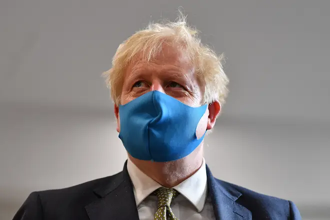 File photo: Prime Minister Boris Johnson, wearing a face mask, during a visit to the headquarters of the London Ambulance Service NHS Trust