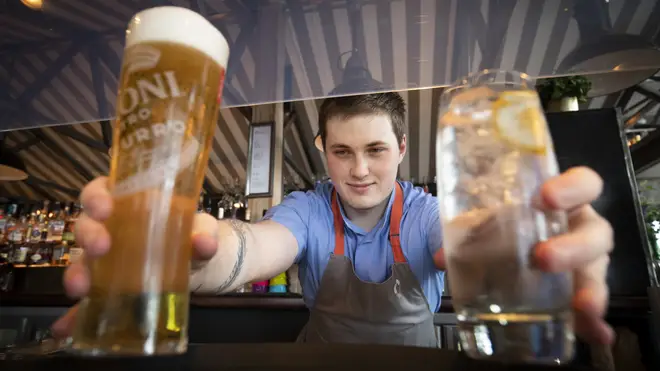 Barman Matthew Williams serves drinks at Scotts in South Queensferry