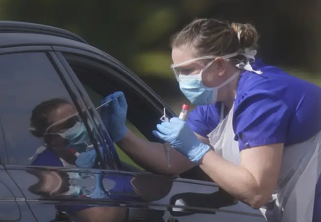 File photo: An NHS worker being tested for coronavirus at a temporary testing station