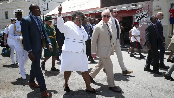The Prince of Wales during a walkabout with the Prime Minister of Barbados Ms Mia Mottley last year