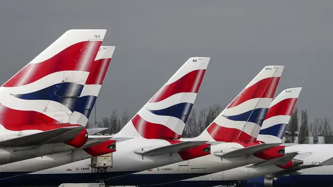 The boss of British Airways has defended the airline's decision to cut up to 12,000 jobs